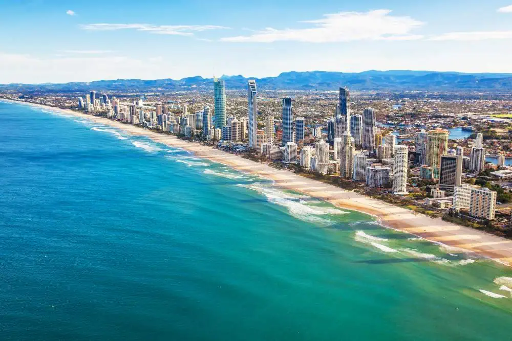 Aerial view of Queensland's tropical coastline and reefs